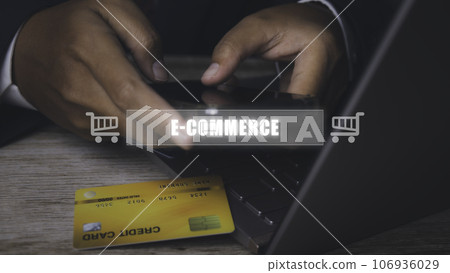 Businessman using mobile phone and credit card shopping online. Businessman using mobile phone and credit card shopping online. 106936029