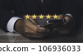 Businessman giving high score five golden stars rating satisfaction in service. 106936033