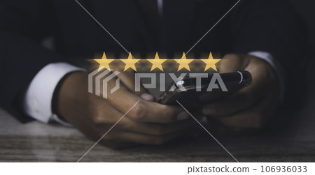 Businessman giving high score five golden stars rating satisfaction in service. 106936033