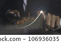 Stock market graph with man using phone financial profit stock development. 106936035