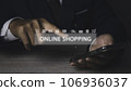 Businessman using mobile phone shopping online with icons E-commerce marketing. 106936037