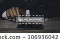 Businessman using mobile phone shopping online with icons E-commerce marketing. 106936042