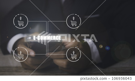 Businessman using mobile phone shopping online with icons E-commerce marketing. Businessman using mobile phone shopping online with icons E-commerce marketing. 106936043