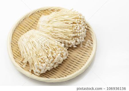 Enoki mushrooms on a tray_white background Enoki mushrooms on a tray_white background 106936136
