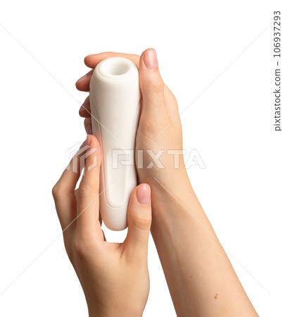 Women hand holding sex toy isolated on white Women hand holding sex toy isolated on white 106937293