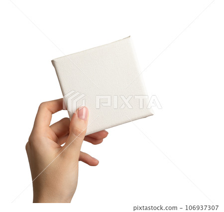 Blank empty white canvas mockup in hand, isolated on white 106937307