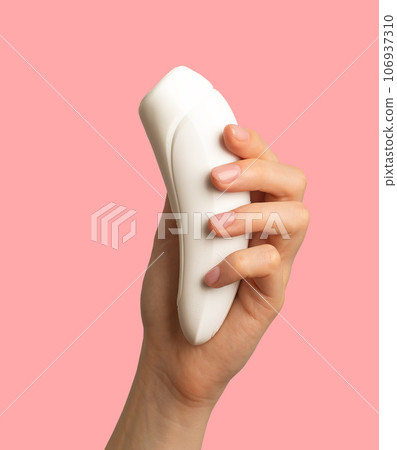 Female hand holding women sex toy, masturbating item Female hand holding women sex toy, masturbating item 106937310