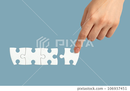 Hand connecting, adding puzzle piece, final touch concept 106937451