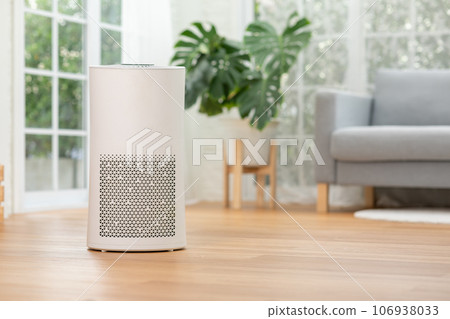 Air purifier in cozy white bed room for filter and cleaning removing dust PM2.5 HEPA in home,for fresh air and healthy life,Air Pollution Concept 106938033