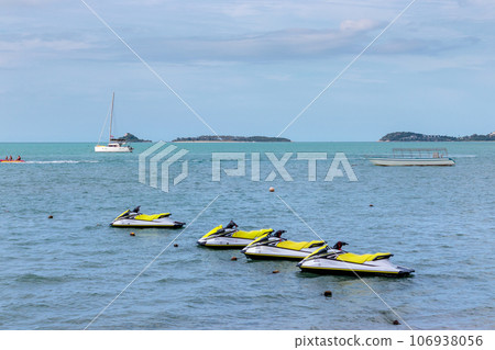 yellow jet ski floating in Bay yellow jet ski floating in Bay 106938056