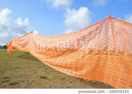 Orange sheet leading to the blue sky 106938193