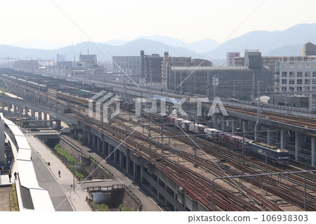 Sanyo Main Line freight train passing near Himeji Station (EF210 type traction) 106938303