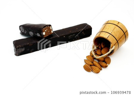 Chocolate bars and almonds isolated on white background 106939478