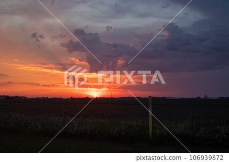 Bright Orange sunrise over Nebraska corn field 106939872