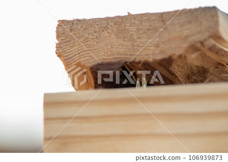 Close up of two 2x4 nailed together Close up of two 2x4 nailed together 106939873