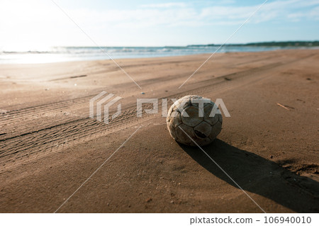 Calm sandy beach at sunset 106940010