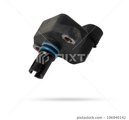 Electromagnetic crankshaft position sensor of a car engine in the hands of an auto mechanic. Spare parts catalog. 106940142