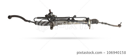 Spare part of the car steering rack new in plastic packaging for turning the wheels close-up on the floor of the tile to perform vehicle maintenance in auto service. Spare part of the car steering rack new in plastic packaging for turning the wheels close-up on the floor of the tile to perform vehicle maintenance in auto service. 106940158