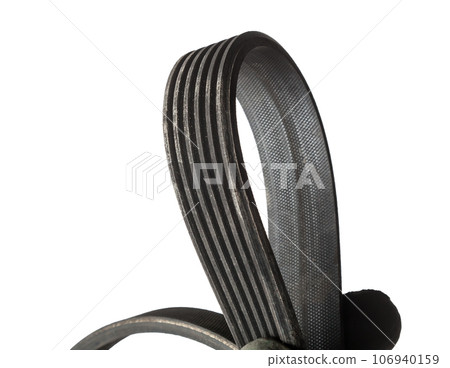 V-ribbed engine belt made of black rubber on a white isolated background in a photo studio of auto parts for replacement during repair or for a catalog of spare parts for sale on auto analysis. V-ribbed engine belt made of black rubber on a white isolated background in a photo studio of auto parts for replacement during repair or for a catalog of spare parts for sale on auto analysis. 106940159