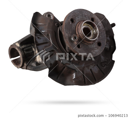 A close-up of a worn metal wheel hub with oil and rust elements on a white background. Seasonal undercarriage repair and replacement of brake system parts in a workshop. 106940213