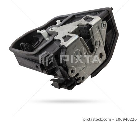 Detail of a car spare part made of black plastic and metal - door lock separately isolated on a white background. Repair in a car workshop, equipment for sale. 106940220