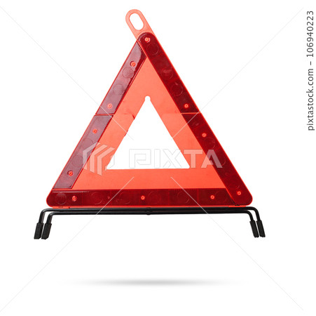 Warning stop sign made of red reflective plastic with a blue case on a white isolated background in a photo studio. Mandatory device for being in the car. Spare part for sale on auto parsing. Warning stop sign made of red reflective plastic with a blue case on a white isolated background in a photo studio. Mandatory device for being in the car. Spare part for sale on auto parsing. 106940223