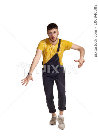 Full-length portrait of a funny guy dancing in studio isolated on white background. Full-length portrait of a funny guy dancing in studio isolated on white background. 106940398