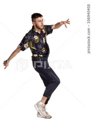 Full-length portrait of a funny guy dancing in studio isolated on white background. Full-length portrait of a funny guy dancing in studio isolated on white background. 106940408
