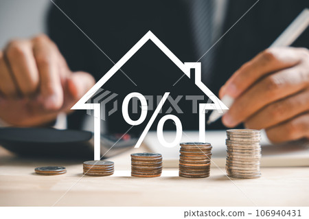 An ascending arrow on a graph points to the buoyant real estate market. A house model and coin stack beside it depict inflation, economic growth, and insurance service costs. Property value is rising. An ascending arrow on a graph points to the buoyant real estate market. A house model and coin stack beside it depict inflation, economic growth, and insurance service costs. Property value is rising. 106940431