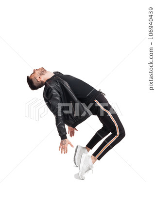 Full-length photo of a funny guy dancing in studio isolated on white background. 106940439