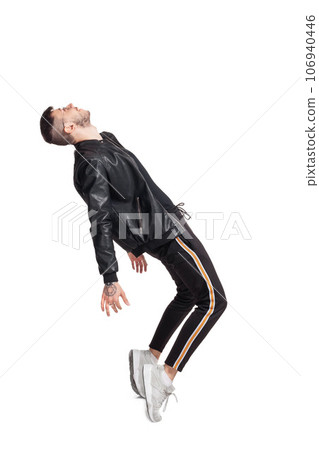 Full-length photo of a funny guy dancing in studio isolated on white background. 106940446
