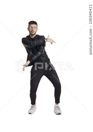 Full-length photo of a funny guy dancing in studio isolated on white background. Full-length photo of a funny guy dancing in studio isolated on white background. 106940451