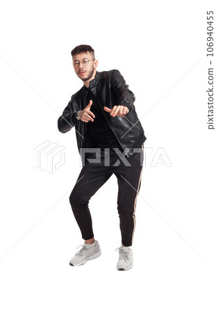 Full-length photo of a funny guy dancing in studio isolated on white background. Full-length photo of a funny guy dancing in studio isolated on white background. 106940455