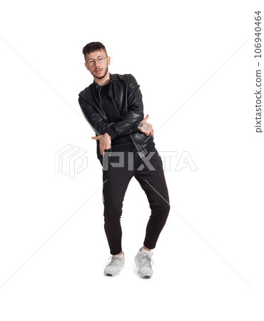 Full-length photo of a funny guy dancing in studio isolated on white background. Full-length photo of a funny guy dancing in studio isolated on white background. 106940464