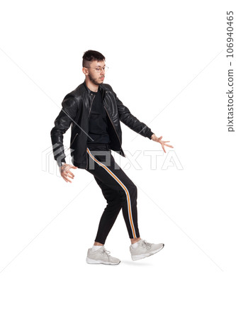 Full-length photo of a funny guy dancing in studio isolated on white background. Full-length photo of a funny guy dancing in studio isolated on white background. 106940465