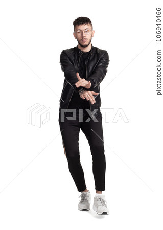 Full-length photo of a funny guy dancing in studio isolated on white background. Full-length photo of a funny guy dancing in studio isolated on white background. 106940466
