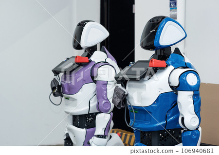 two humanoid robots guides with medical functions in the workshop where they were assembled two humanoid robots guides with medical functions in the workshop where they were assembled 106940681