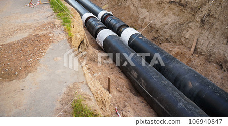 Installation of the distribution unit of heating and water supply network. Frame for connecting pipes in the trench of ground Installation of the distribution unit of heating and water supply network. Frame for connecting pipes in the trench of ground 106940847