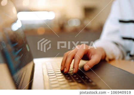Female hands working on laptop, close-up. Technology, Freelance, online course, remote work concept. 106940919