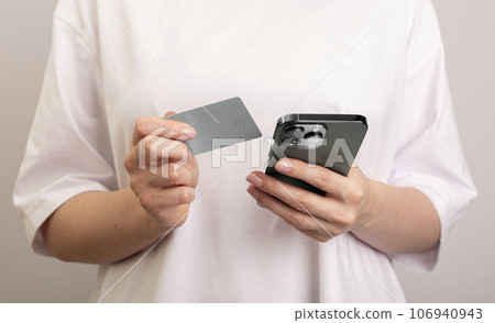 Berlin, Germany September 16 2023 Online payment with smartphone and bank card Berlin, Germany September 16 2023 Online payment with smartphone and bank card 106940943