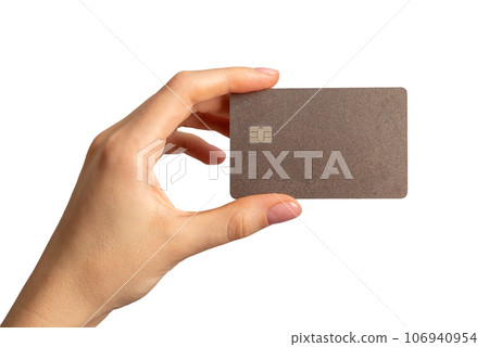 Hand holding bank card mock up, plastic with chip, isolated on white background Hand holding bank card mock up, plastic with chip, isolated on white background 106940954