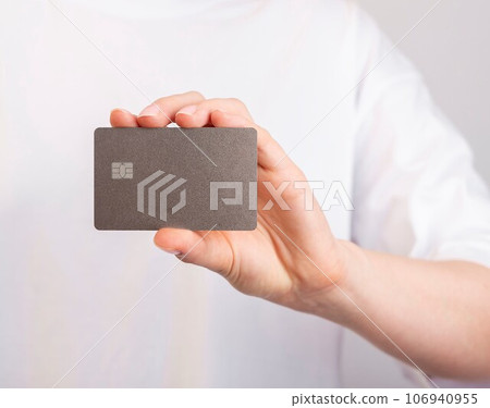 Hand holding bank card mockup, bankcard with chip Hand holding bank card mockup, bankcard with chip 106940955