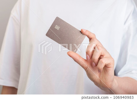 Plastic bank card mockup in hand 106940983