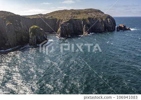 Aerial view of cliffs and sea stacks on Owey Island, County Donegal, Ireland Aerial view of cliffs and sea stacks on Owey Island, County Donegal, Ireland 106941083