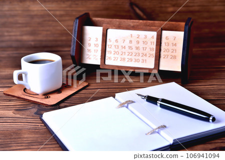Notebook coffee cup and calendar Notebook coffee cup and calendar 106941094