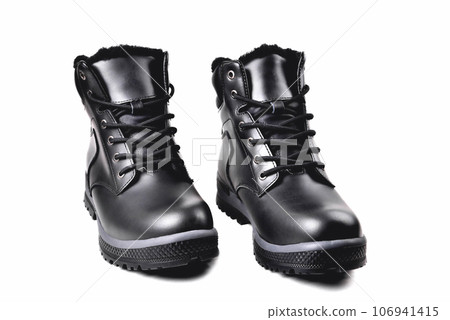 Winter mens black leather boots on a white background, hiking shoes, practical off-road shoes, close-up 106941415