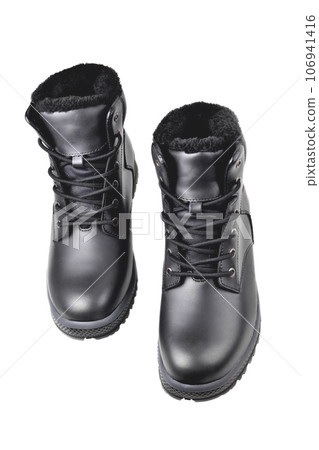 Winter mens black leather boots on a white background, hiking shoes, practical off-road shoes, close-up 106941416