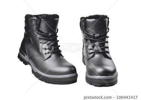 Winter mens black leather boots on a white background, hiking shoes, practical off-road shoes, close-up 106941417