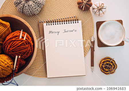 Morning Journal, Journaling Techniques Tips for Writing Morning Pages. Open notebook with text Morning Journal, coffee cup, pen and decor on table 106941683