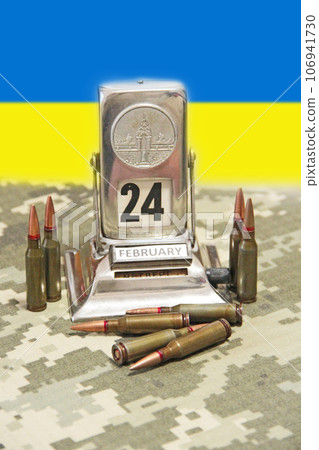 Bullets, vintage calendar and Ukrainian flag against background 106941730